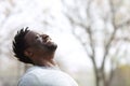 Happy black man breathing fresh air outdoors in winter Royalty Free Stock Photo