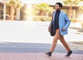 Happy black man, city and walking to work for business travel, trip or opportunity on outdoor sidewalk. African Royalty Free Stock Photo