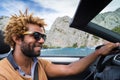 Happy black man driving a convertible car. Royalty Free Stock Photo