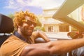 Happy black man driving a convertible car. Royalty Free Stock Photo