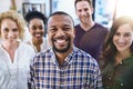 Happy black man, portrait and office with creative team in business startup, growth or diversity. African male person or Royalty Free Stock Photo