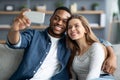 Happy Black Man And White Woman Taking Selfie On Smartphone At Home Royalty Free Stock Photo