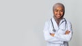 Happy Black Muslim Female Doctor Student In Hijab And White Coat