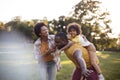 Happy black parents having fun with their daughter at the park Royalty Free Stock Photo
