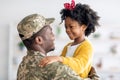 Happy Black Soldier Father And His Cute Little Daughter Embracing At Home Royalty Free Stock Photo