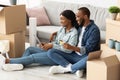 Happy Black Spouses Choosing Furniture Online With Digital Tablet And Credit Card Royalty Free Stock Photo