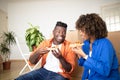 Happy Black Spouses Eating Pizza And Having Fun On Moving Day Royalty Free Stock Photo