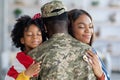 Happy Black Wife And Little Daughter Embracing Soldier Father At Home Royalty Free Stock Photo