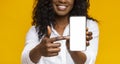 Happy black woman holding latest slim smartphone Royalty Free Stock Photo