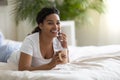 Happy Black Woman Lying In Bed, Talking On Cellphone And Drinking Coffee Royalty Free Stock Photo