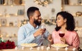 Happy black woman and man drinking wine and laughing Royalty Free Stock Photo