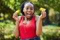 Happy black woman, orange slice and natural vitamin C for nutrition or citrus diet in nature outdoors. Portrait of Royalty Free Stock Photo