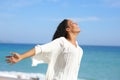 Happy black woman outstretching arms on the beach Royalty Free Stock Photo