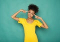 Happy black woman pointing at her head Royalty Free Stock Photo