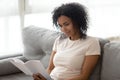 Happy black woman rest at home reading book