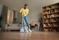 Happy Black Woman Sweeping Floor With Broom Cleaning Home Royalty Free Stock Photo