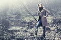 Happy blond fashion woman in classic coat walking outdoor Royalty Free Stock Photo