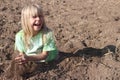 Happy Blond Girl Playing in Dirt
