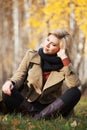 Happy blond woman in autumn forest Royalty Free Stock Photo