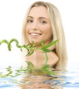 Happy blonde with bamboo Royalty Free Stock Photo