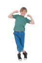 Happy blonde boy tensing arm muscles Royalty Free Stock Photo