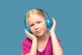 Happy blonde cute girl in headphones