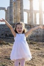 Portrait of a happy, blonde girl in a white summer dress Royalty Free Stock Photo