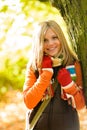 Happy blonde teenager girl autumn forest smiling Royalty Free Stock Photo