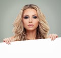 Happy Blonde Woman Fashion Model with White Blank Royalty Free Stock Photo