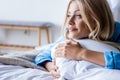 happy blonde woman lying on pillow Royalty Free Stock Photo