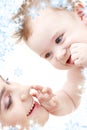 Happy blue-eyed baby boy touching mama Royalty Free Stock Photo