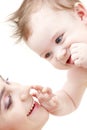 Happy blue-eyed baby boy touching mama Royalty Free Stock Photo