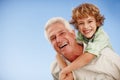 Happy, blue sky and portrait of grandpa and kid for bonding, relationship and relax together outdoors. Family mockup Royalty Free Stock Photo