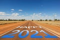 Happy 2021 blue and white gradient text on empty road in Outback Australia Royalty Free Stock Photo