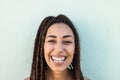 Happy bohemian african girl smiling at camera outdoors - Focus on face