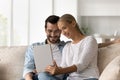 Happy young family couple using digital computer tablet. Royalty Free Stock Photo