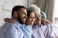 Happy bonding three male generations family looking in distance. Royalty Free Stock Photo