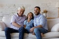 Happy three male generations family talking at home. Royalty Free Stock Photo