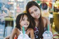 Happy bonding of two sisters in a cafe