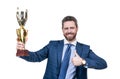 Happy boss hold golden cup giving thumbs up hand gesture isolated on white, best