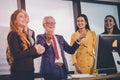 Happy Boss laughing with officer in multiculture office Royalty Free Stock Photo