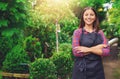 Happy botanist working at a nursery