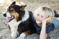 Happy boy with arm around pet dog Royalty Free Stock Photo