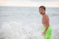 Happy boy bathes in the sea Royalty Free Stock Photo