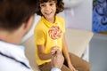 Happy boy with candy near doctor stock photo Royalty Free Stock Photo