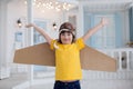 Happy boy with cardboard boxes of wings Royalty Free Stock Photo