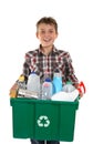 Happy boy carrying rubbish for recycling