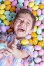 Happy boy catching plastic eggs for Easter fun Royalty Free Stock Photo