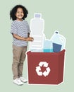 Happy boy collecting plastic bottles in a recycling box Royalty Free Stock Photo