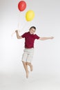 Happy boy with colorful balloons